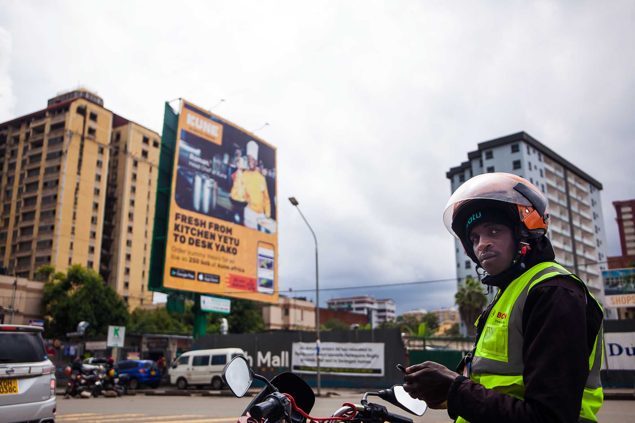 A billboard on one of the kenyan roads advertising food by means of online orders and delivery
